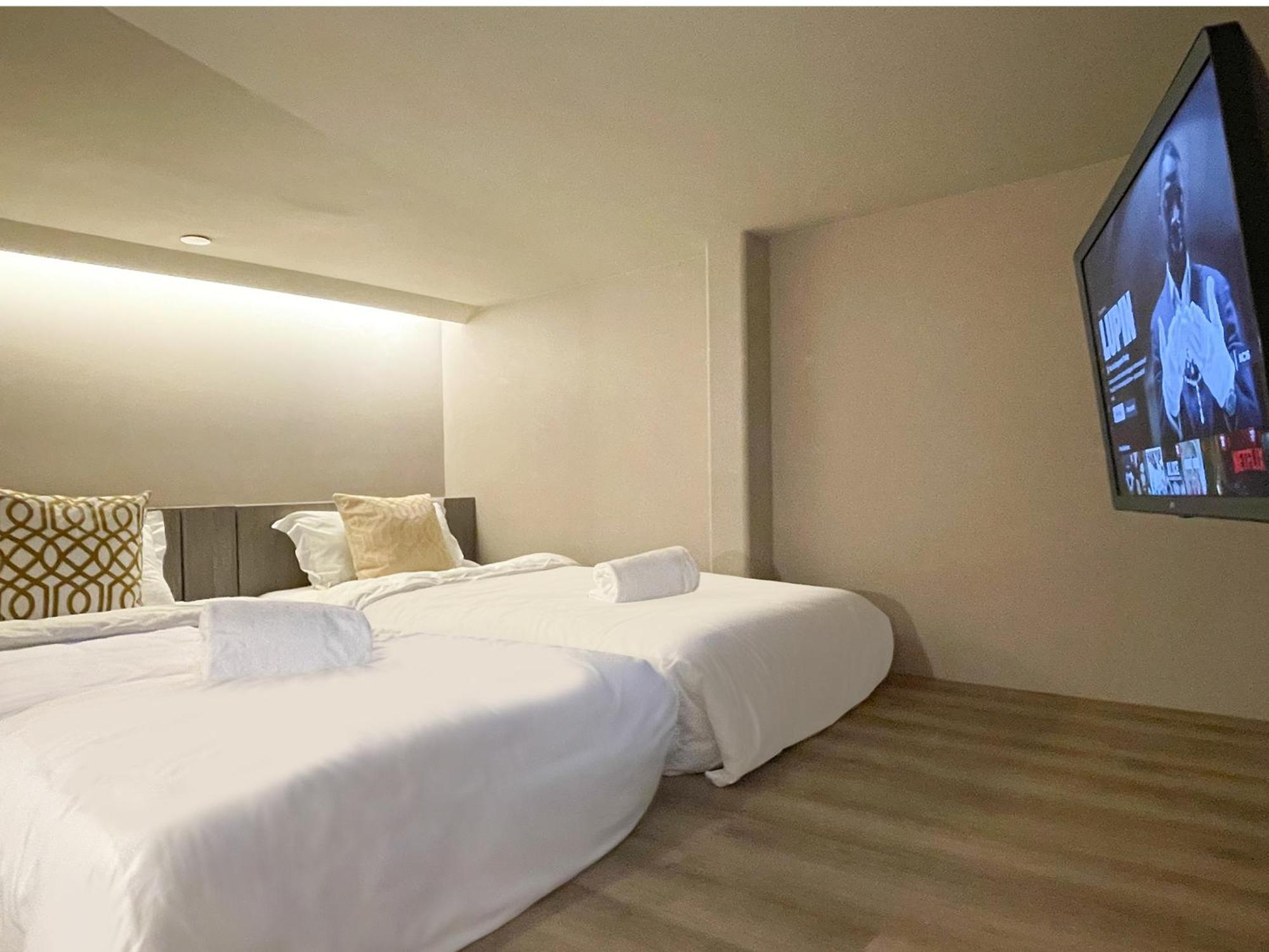 Cabina M Doppia con Letti Singoli con Bagno in Comune