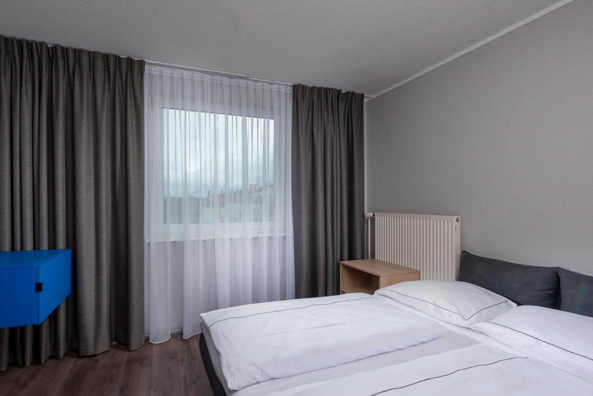 Family Suite with Two Single Beds and  Sofa