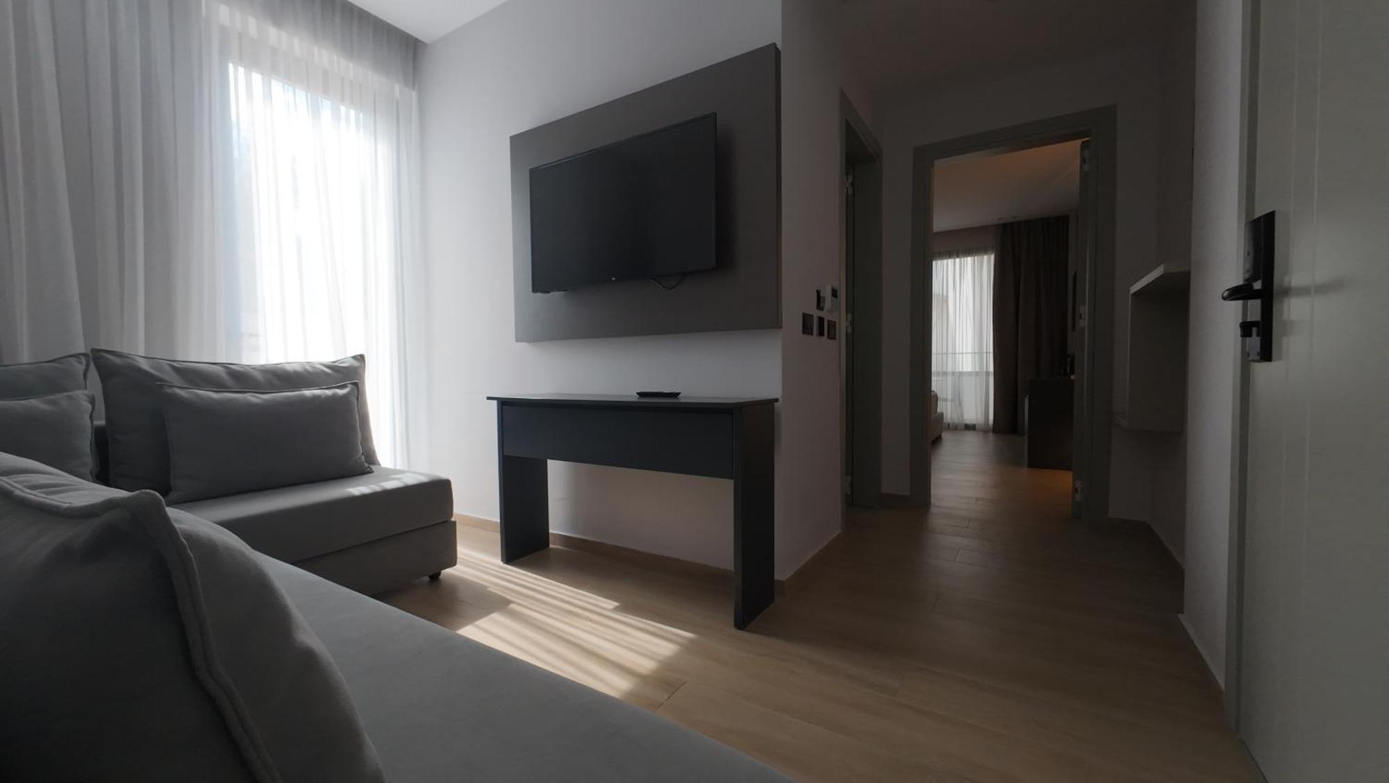 Deluxe Queen Suite with Balcony and Side Sea View