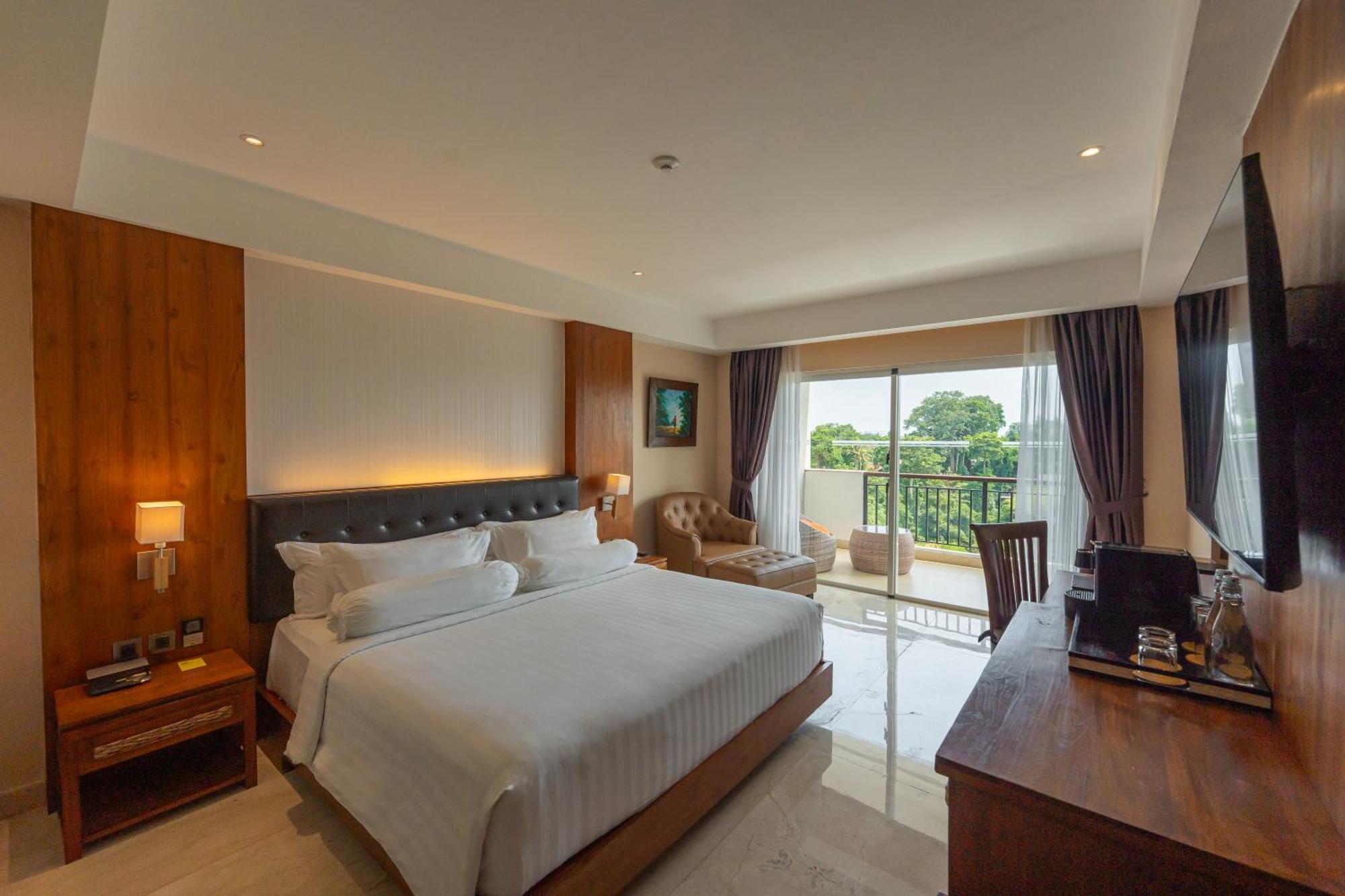 Deluxe King Balcony Room River View daily shuttle to Ubud City Photo Session Art Gallery Visit 24-hour access to Fitness Center Welcome Drink Kids Activities