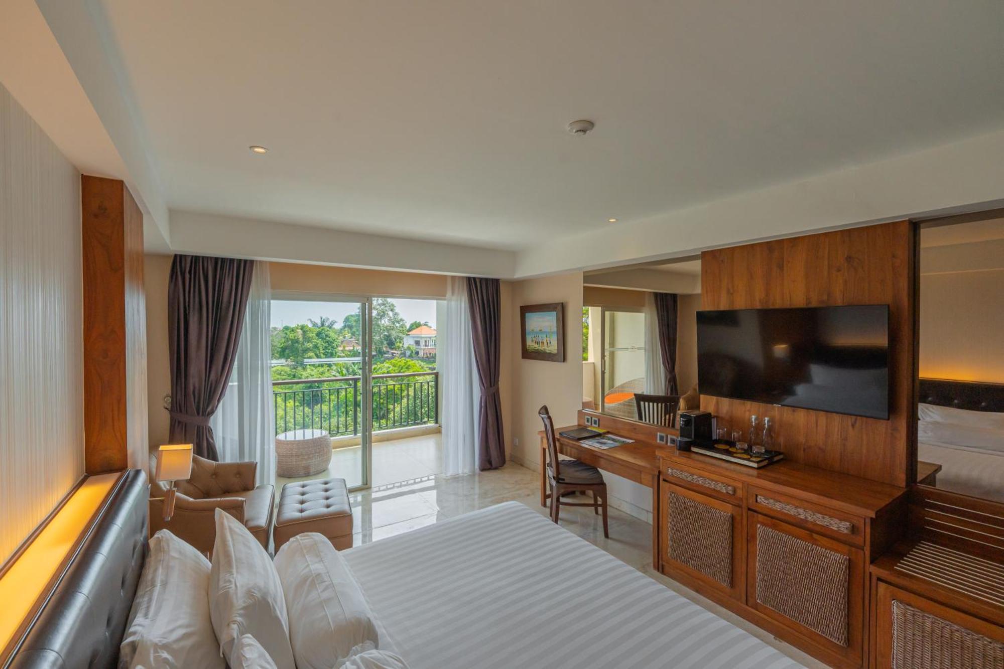 Deluxe King Balcony Room River View daily shuttle to Ubud City Photo Session Art Gallery Visit 24-hour access to Fitness Center Welcome Drink Kids Activities