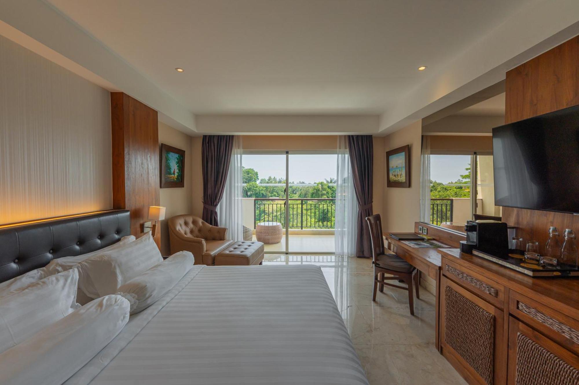 Deluxe King Balcony Room River View daily shuttle to Ubud City Photo Session Art Gallery Visit 24-hour access to Fitness Center Welcome Drink Kids Activities