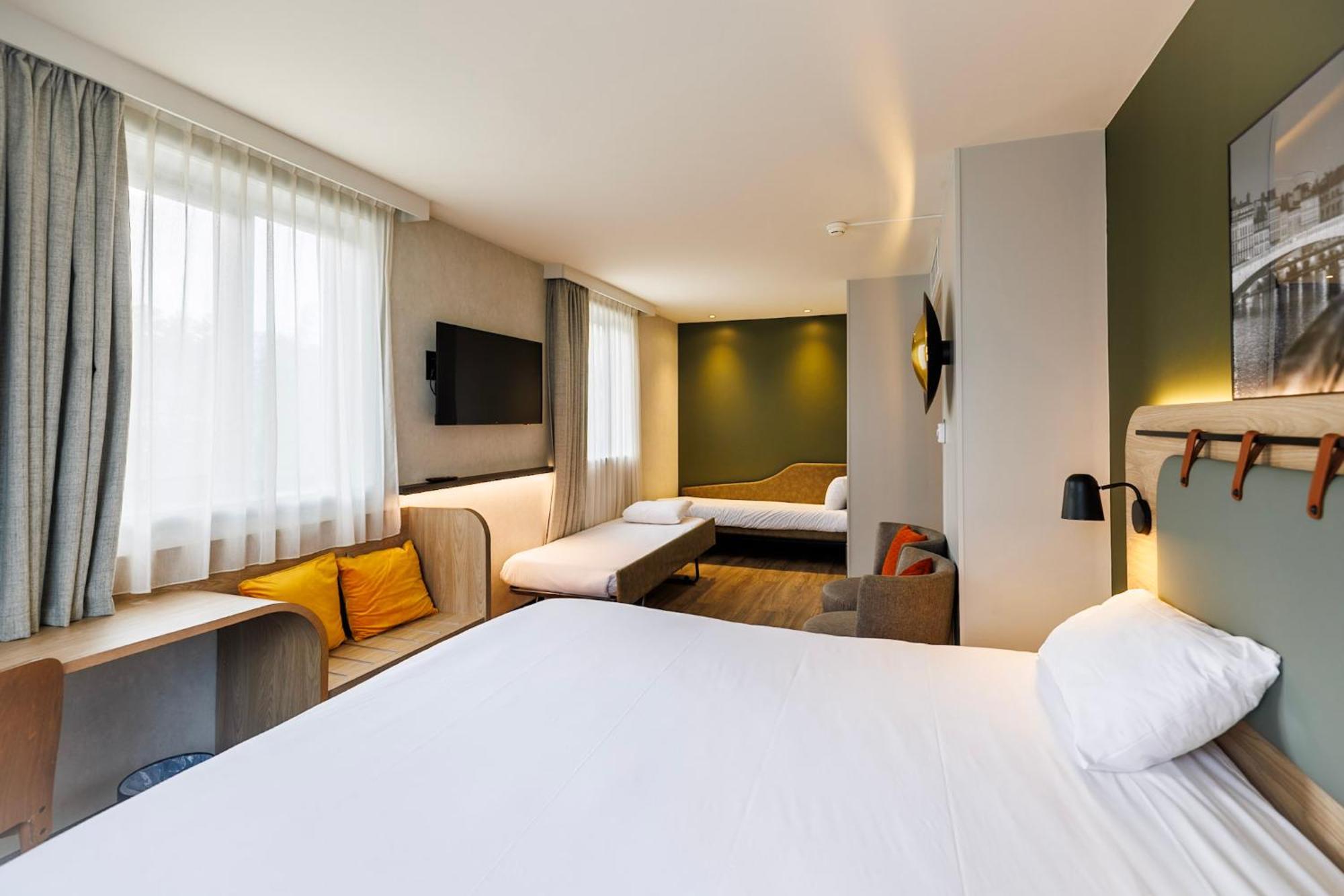 Quadruple Room One Double Bed Two Single Beds or Sofa Bed