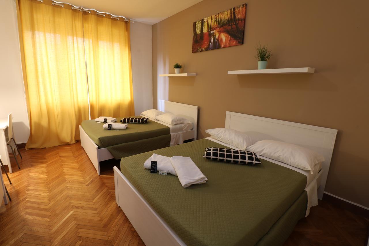 Camera Quadrupla con Bagno Esterno in Comune